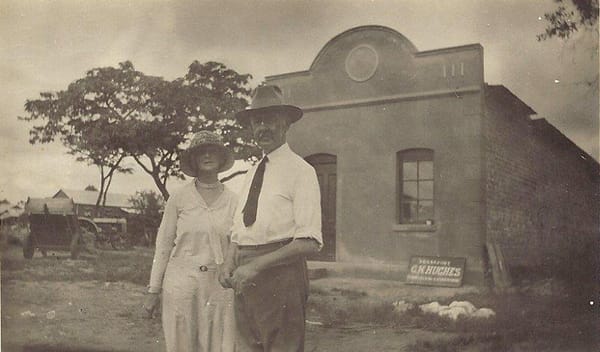 Gervas' parents Charles and Cecily Hughes on one of their many visits to Que Que standing outside Gervas' office 1930