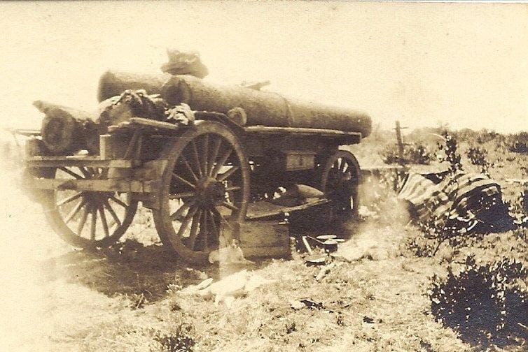 Loading Gervas Hughes wagon with logs for the Globe and Phoenix Mine, 1929.