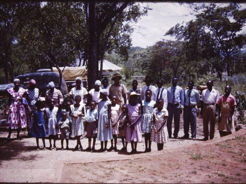 1961, Happy Times. The staff at Gervas Hughes' Giraffe Farm dressed in their Christmas bonsella clothes