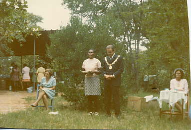 Mrs. Hobane standing beside Mayor Vic Jenkinson as he talks about the creation of adjoining Sable Park with a presentation of