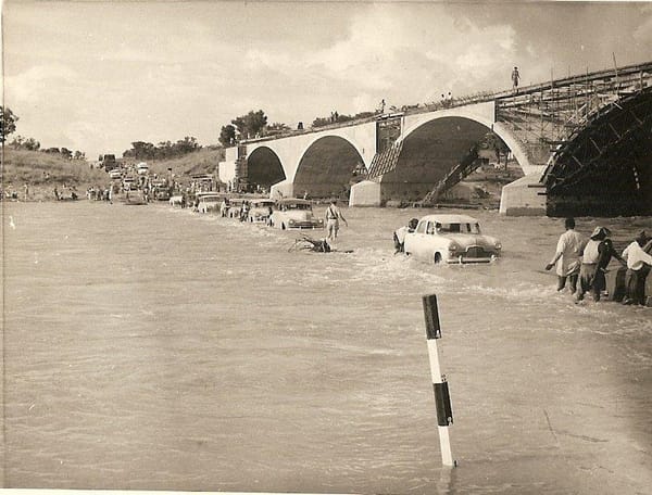 Umniati River in flood with the new bridge under construction