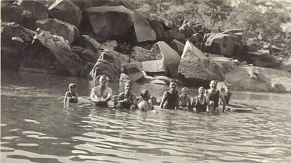 Gervas Hughes and the Wiggins family wallowing at Dutchmans' Pool, Que Que in the early 1930's