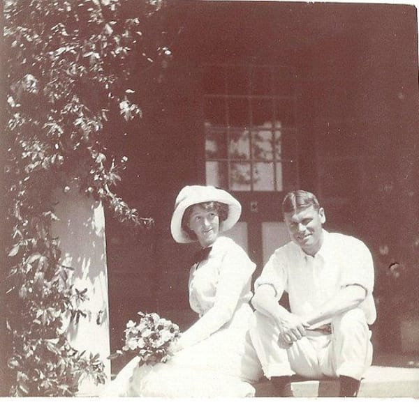 Dr. Philip Millard and his beautiful Australian red headed wife Ursula on the steps of their home in Herschel in the Eastern 