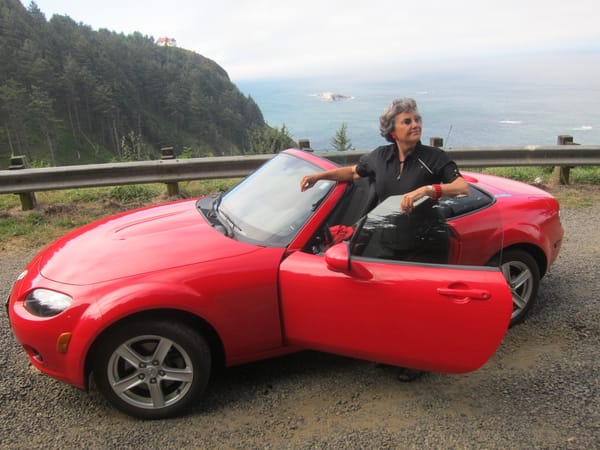 Me and my little red car on the 20 miracle miles of Oregon's Central Coast